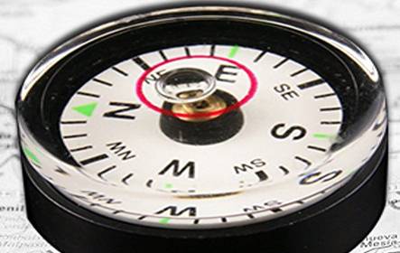 There is a compass with spirit level vial on the ground.